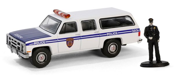 GREEN97160-D - GMC Suburban 2500 1985 Police mit Figur aus der Serie THE HOBBY SHOP in Blisterverpackung - 1