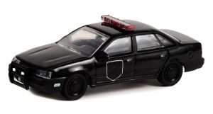 GREEN28110-F - FORD Taurus 1988 Black Bandit Police aus der Serie BLACK BANDIT in Blisterverpackung.